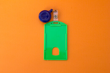 “Professional ID Badge Holder”: A sturdy green plastic name tag holder with an oval opening for easy card access. Ideal for conferences, offices, and events.