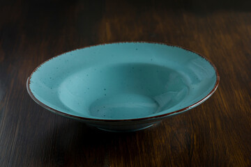 green stone plate on a wooden table