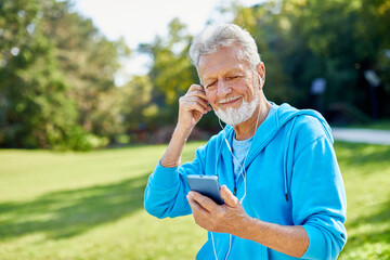man outdoor senior  elderly phone fitness mobile smartphone music earphone app communication active fun old nature using internet connection smart phone mature retirement listen headphone training