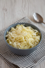 Homemade German Sauerkraut in a Bowl, side view.