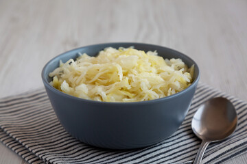 Homemade German Sauerkraut in a Bowl, side view.