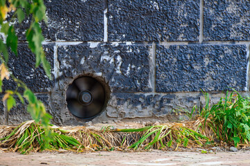 operational basement exhaust fan, symbolizing the unseen yet vital mechanisms that ensure air quality and comfort in high-rise residential buildings
