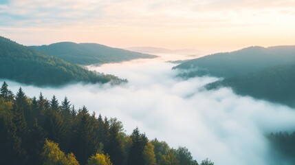 Serene landscape with misty valleys and rolling hills at sunrise.