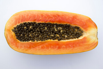 The papaya, with its vibrant orange flesh and round black seeds, is a staple in tropical fruit...