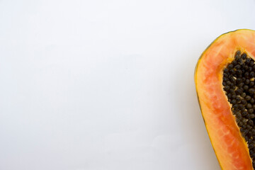 The papaya, with its vibrant orange flesh and round black seeds, is a staple in tropical fruit...