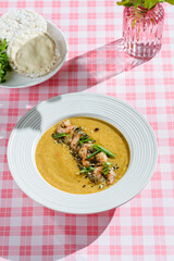 pumpkin soup with shrimp and pumpkin seeds