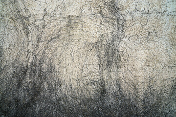 Texture of an old wall with cracked plaster.