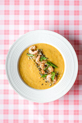 pumpkin soup with shrimp and pumpkin seeds