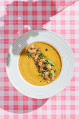 pumpkin soup with shrimp and pumpkin seeds