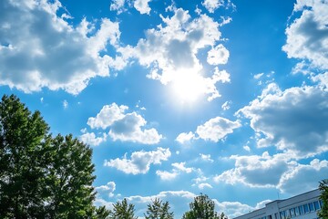 Obraz premium Sunny day with white fluffy clouds in blue sky