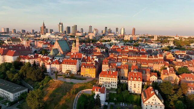 Aerial view of the Warszawa cityscape. Old town and modern skyscrapers at sunrise, Royal Castle. Poland.