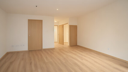 Obraz premium Large windows and sliding glass doors invite abundant sunlight, enhancing the bright and airy atmosphere.