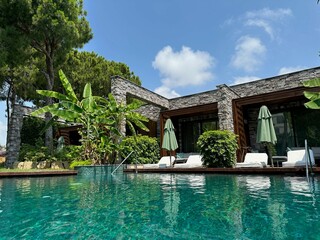 Outdoor swimming pool with clear water at luxury resort