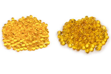 A group of yellow capsules isolated on a white background.