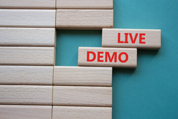 Live Demo symbol. Concept word Live Demo on wooden blocks. Beautiful grey green background....