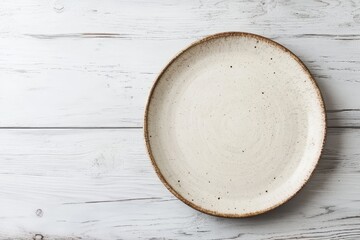 Blank dish on a white wood table overhead angle