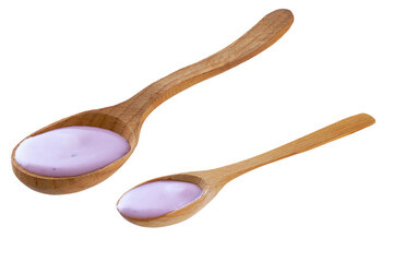 Wooden spoon with blueberry yogurt isolated on a white background.