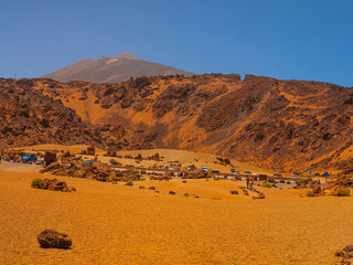 spot in Tenerife with many red rocks and beautiful mountain landscape background