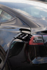 Plugged in electric car at EV charging station