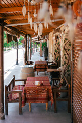 Rustic café in Cappadocia with traditional Turkish textiles and wooden seating. The setting evokes a calm, cultural dining experience perfect for travelers seeking local charm.