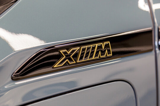 BMW XM - Luxury car fully electric edrive technology in plug-in hybrid system - logo. BMW XM 50e exterior details, logo on the fender of the car. New BMW XM. 
