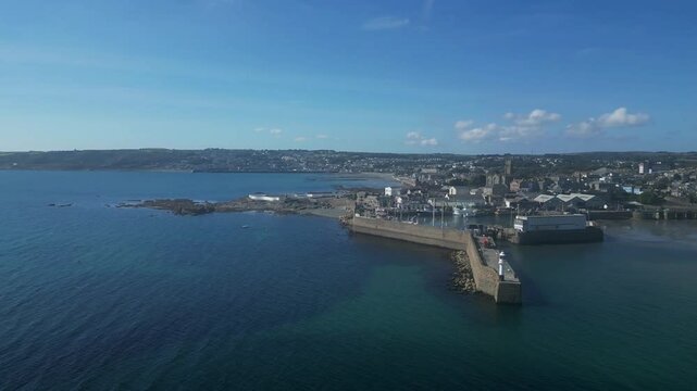 Penzance, Cornwall, England: DRONE VIEWS: The drone circles Penzance harbour showing the town and coastline. The mainline railway terminates at Penzance, which is a popular UK holiday destination (5).