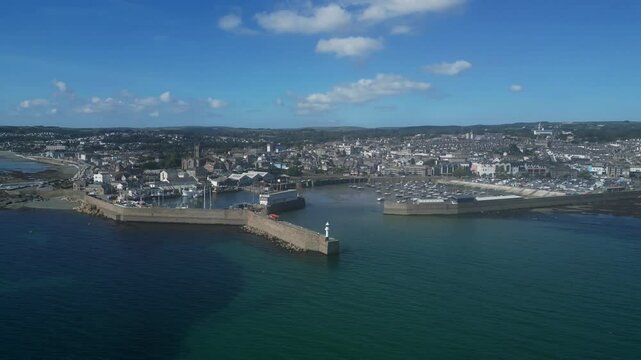 Penzance, Cornwall, England: DRONE VIEWS: The drone circles Penzance harbour showing the town and coastline. The mainline railway terminates at Penzance, which is a popular UK holiday destination (3).