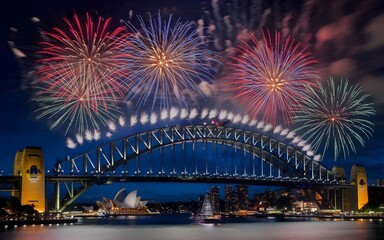 Fireworks explode over the Sydney Harbour Bridge during a celebration.
