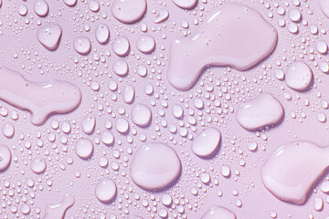 Cosmetic lylac lavender light purple swatch of face cleansing water, tonic or wash soap foam cleansing gel isolated on violet background