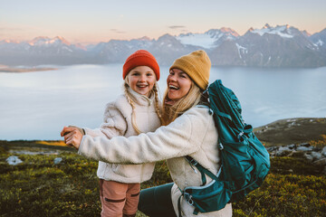 Mother and child daughter laughing having fun outdoor family hiking together travel lifestyle active vacations, woman with backpack playing with kid in mountains candid emotions, Mothers day holiday