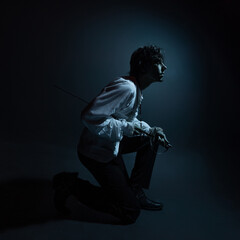 A dramatic hero with a sword in his hands, suffering from defeat and injury, a portrait in the...