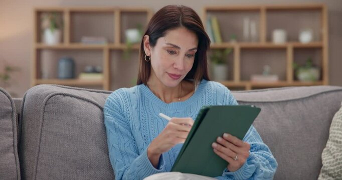 Mature woman, sofa and scroll with tablet for online gaming, entertainment or relax on weekend. Female person, happy and rest on technology on mobile app, streaming service and social network in home