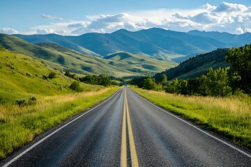 Empty asphalt road going through a valley surrounded by mountains