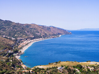 Coast of Sicily landscape as seen from Taormina on a sunny summer day. 