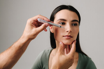 Marking plan of rhinoplasty nose surgery for accurate result. Young girl wants to correct birth...