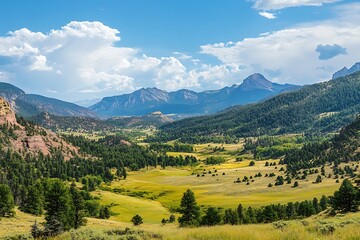 Obraz premium Panoramic View of Mountain Valley with Blue Sky and Puffy Clouds