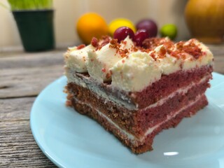 delicious piece of cherry cake covered with icing and cherries. High quality photos