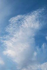 gentle white clouds in the blue sky