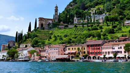 Beautiful Old Town Morcote and Church on Mountain Side and on Waterfront to Lake Lugano in a Sunny Summer Day in Morcote, Ticino, Switzerland, Europe