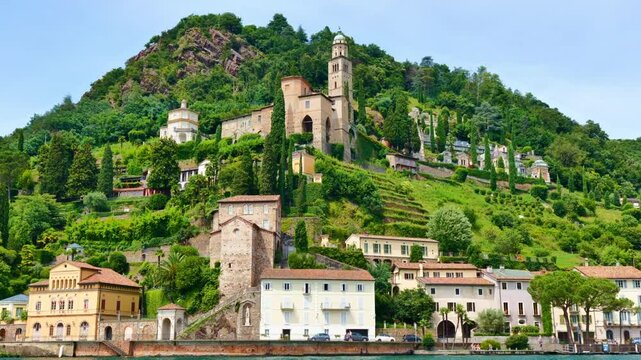 Beautiful Old Town Morcote and Church on Mountain Side and on Waterfront to Lake Lugano in a Sunny Summer Day in Morcote, Ticino, Switzerland, Europe