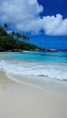 waves beach seychelles  water beach surf nature sea wave ocean landscape travel vacation sun summer natural sunny cloud tropical sunlight background coast seascape blue sky bay sand scenic day island