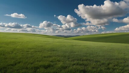 Fototapeta premium Landscape image featuring a vast, gently rolling green hill under a clear vibrant blue sky, nature background