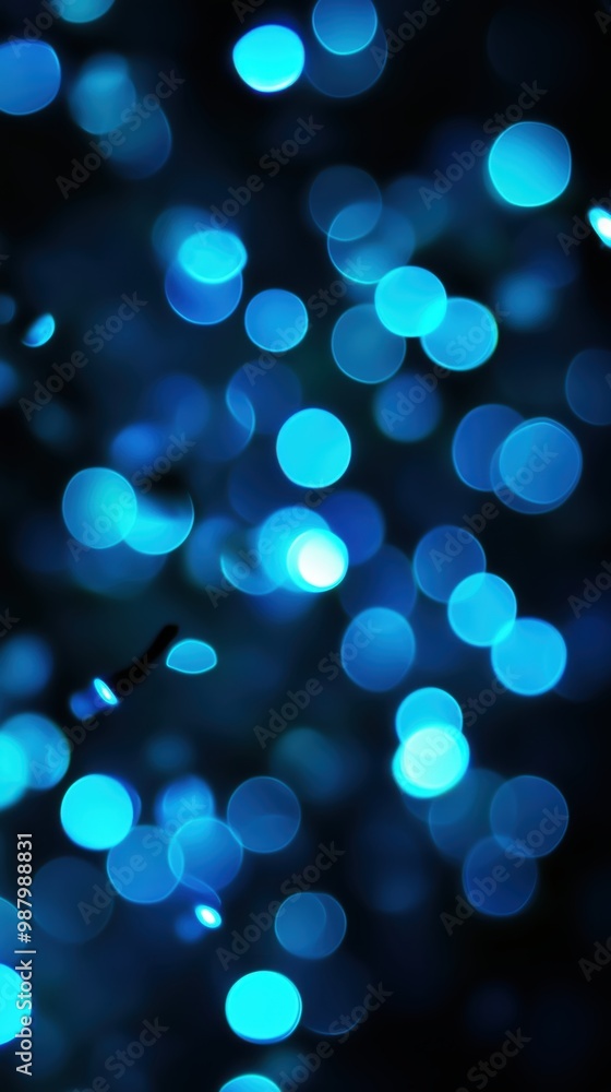 Poster abstract image featuring soft blue bokeh lights against a dark background, creating a dreamy atmosph