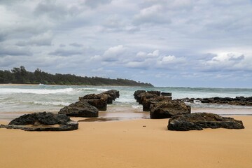 Rocky formations on serene beach