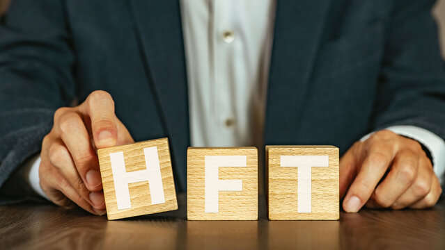 There is wood cube with the word HFT. It is an abbreviation for High Frequency Trade as eye-catching image.