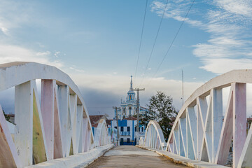 Bridge with church in the background in the city of Taperoá, state of Paraíba, backlands of Brazil.