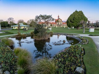 The Rotorua Museum, pond and park of the Government Gardens, Rotorua, Bay of Plenty, New Zealand.