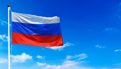 Waving Russia flag on blue sky background, with space for copy