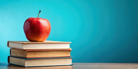 Apple on stack of books against blue background, back to school concept , back to school, education, learning