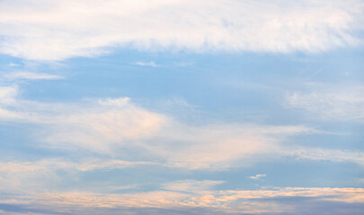 Late afternoon, faint white clouds in the blue sky.